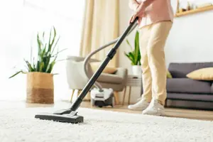 man-vacuuming-tiny