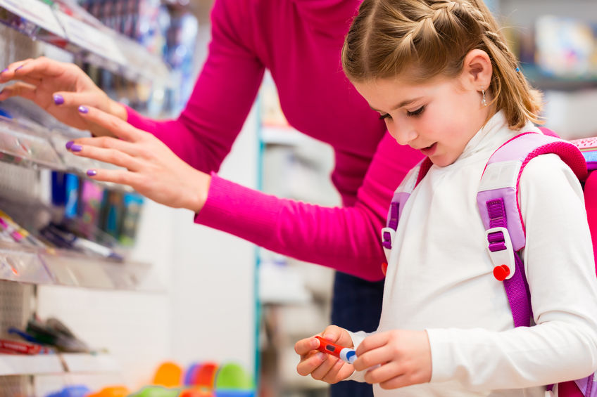 Girl and mom school shopping.