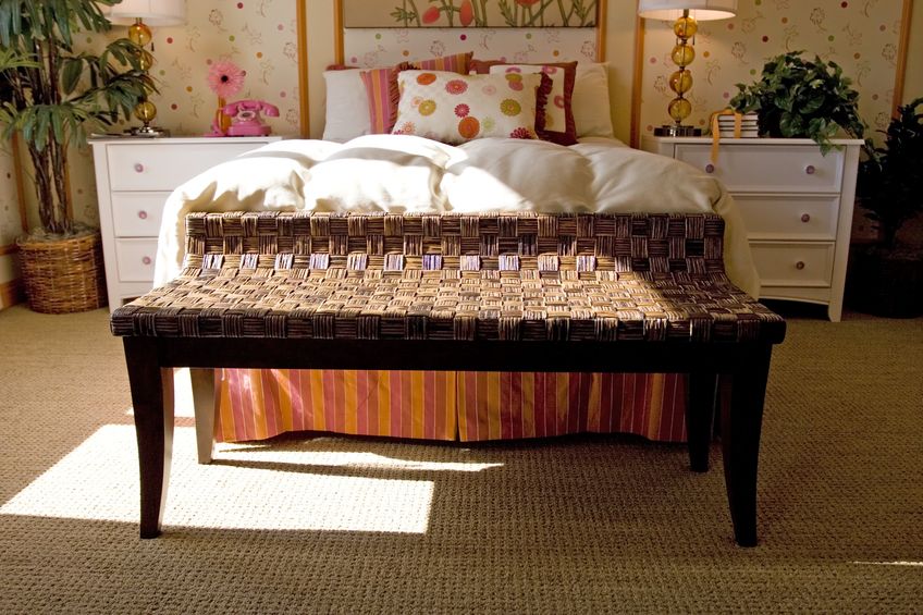 Large bed draped in luxury linens and pillows.