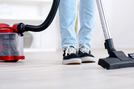 Child's feet canister vacuum.