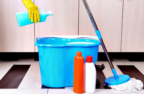 Cleaning bucket on laminate floor.