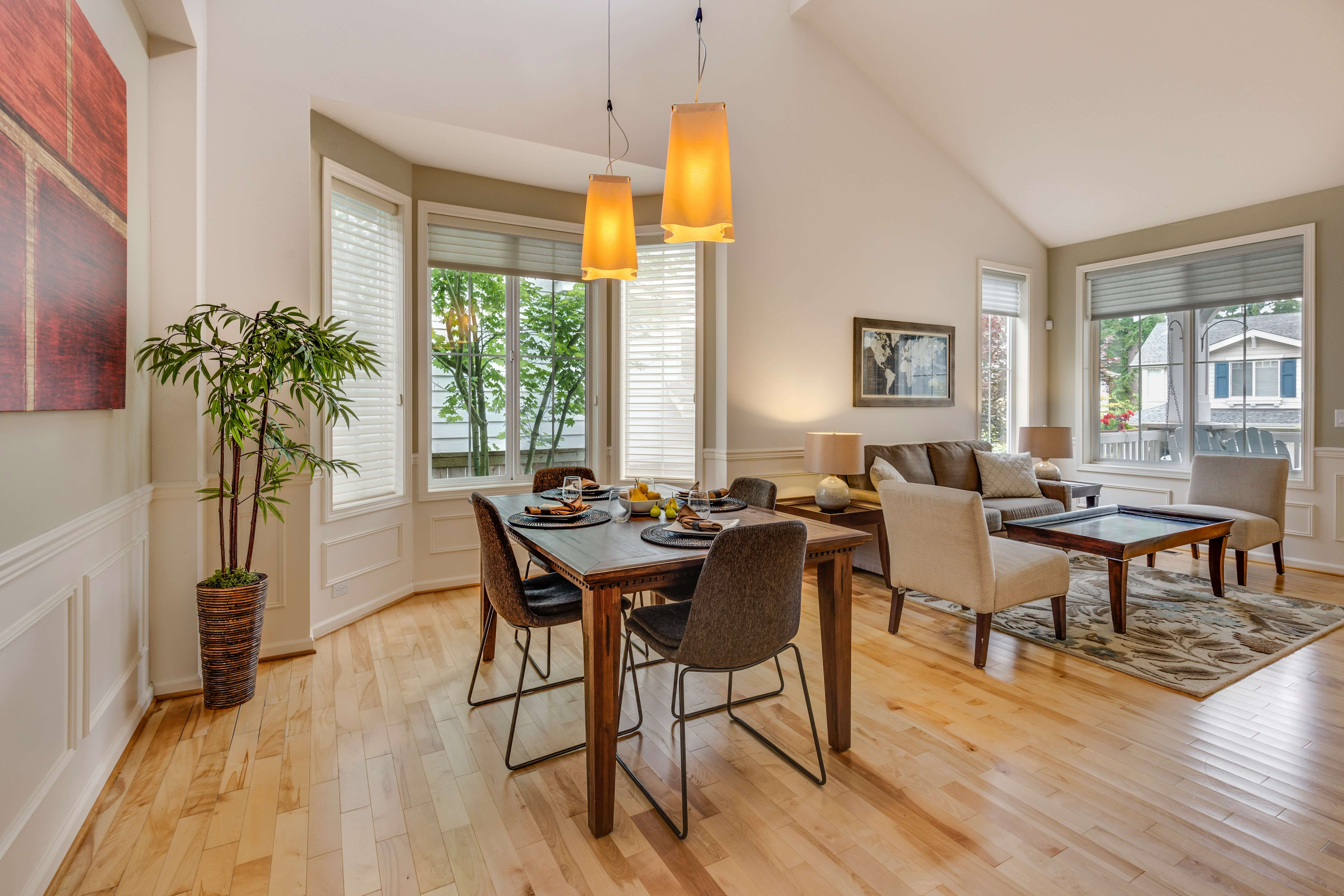 A living room with a game area inside. Living room with game area inside.