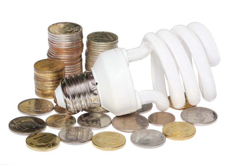Energy efficent light bulb and coins.
