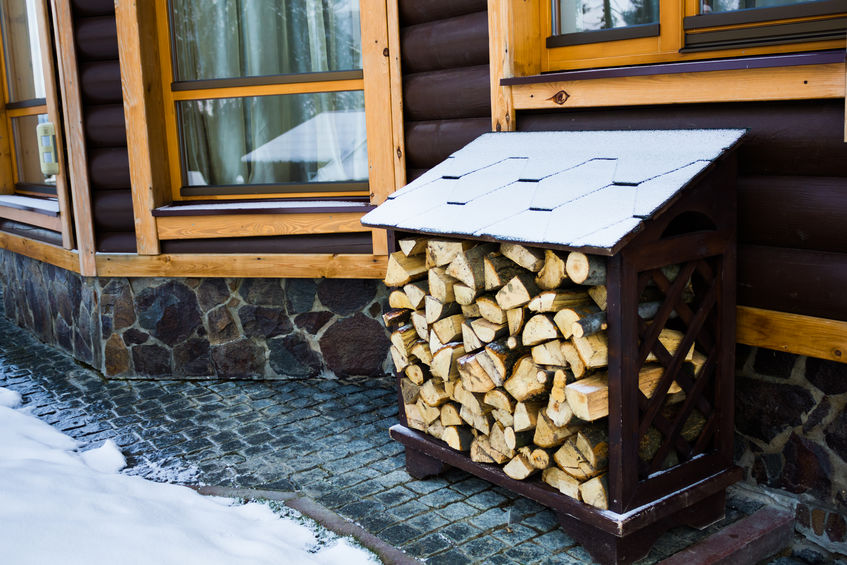 Firewood stacked outside home.