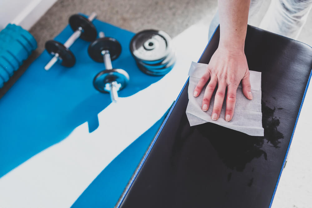Hand cleaning a yoga mat.