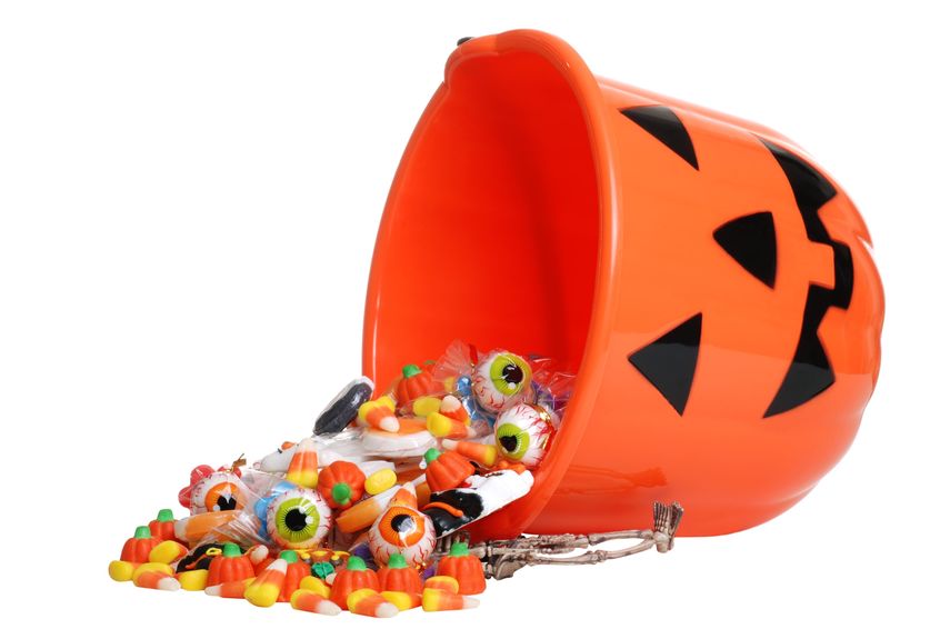 Plastic halloween pumpkin with candy.