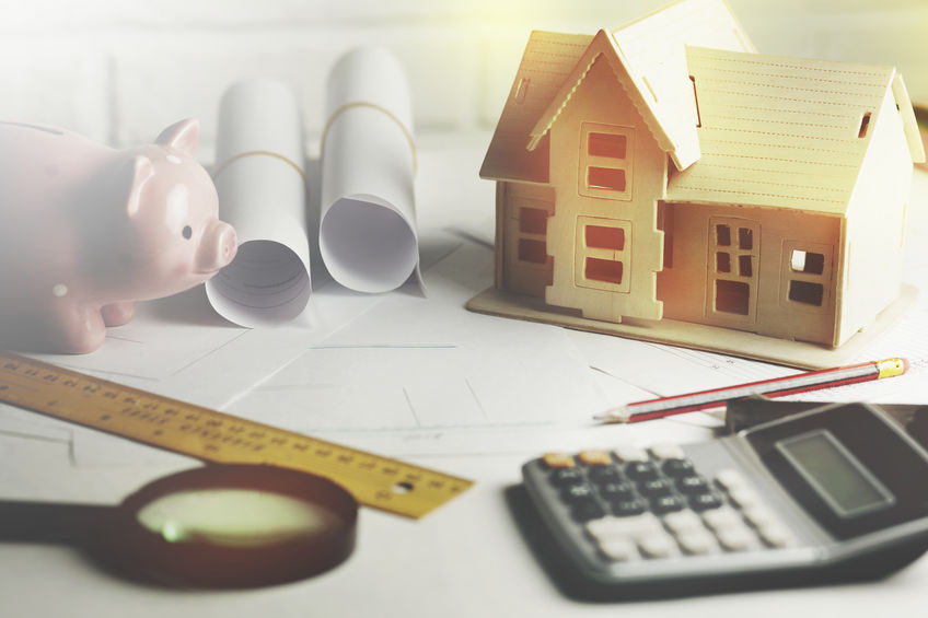 Calculator and piggy bank.