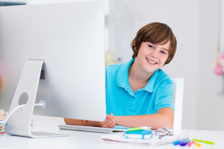 Young boy at computer.