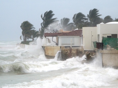 Storm waves hitting island home.