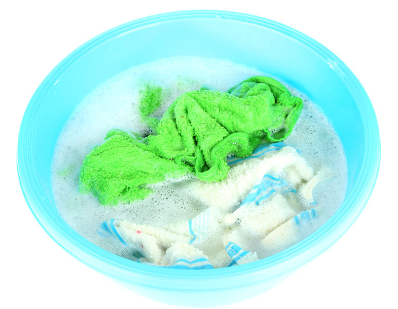 Stained clothing soaking in tub.