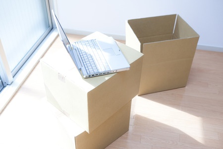 Storage boxes with laptop computer on top.