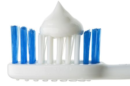 Closeup of toothbrush with toothpaste.