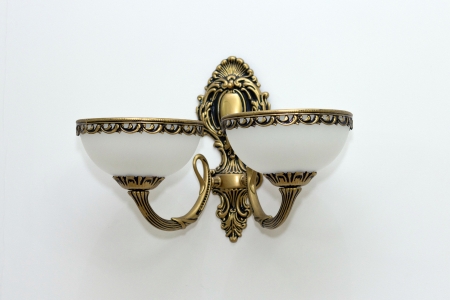 Glass wall sconce on wall.